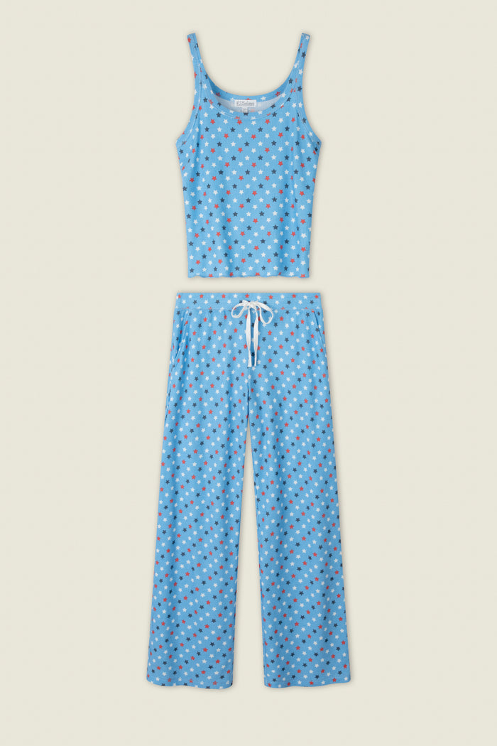 Blue fabric with small red, white, and blue star prints; includes a touch of white detail against the starry pattern.