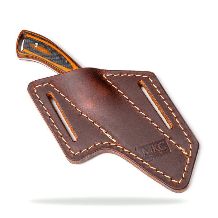 Angled leather sheath for secure belt carry, designed for Montana Knife Company's fixed-blade knives. Durable and stylish.