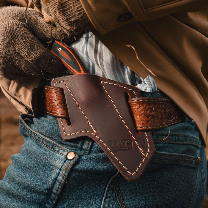 Angled leather sheath for belt carry, designed for Montana Knife Company's knives, showcasing durability and style.