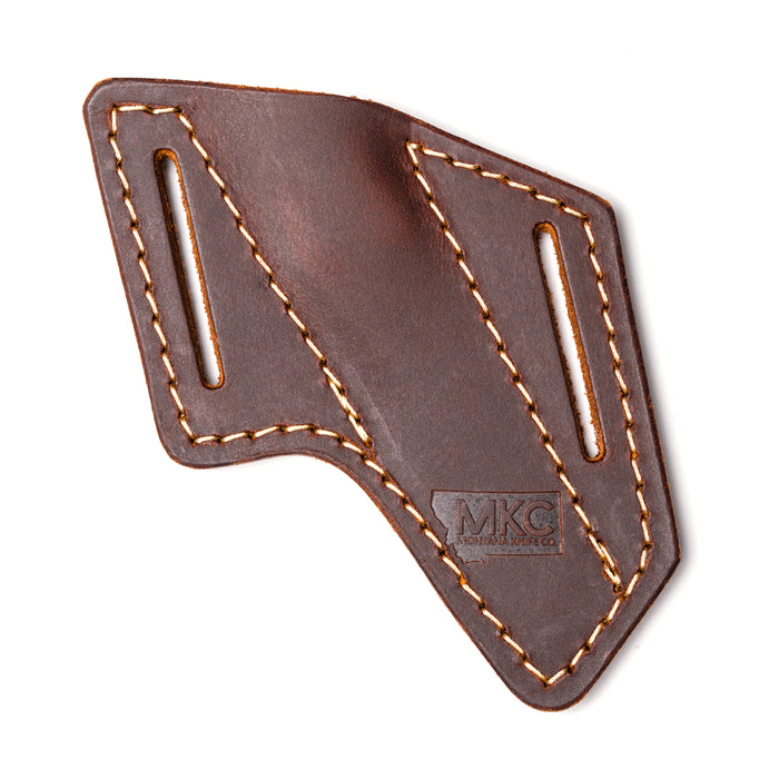 Angled leather sheath for belt carry, designed for durability and functionality, featuring sturdy stitching and MKC branding.