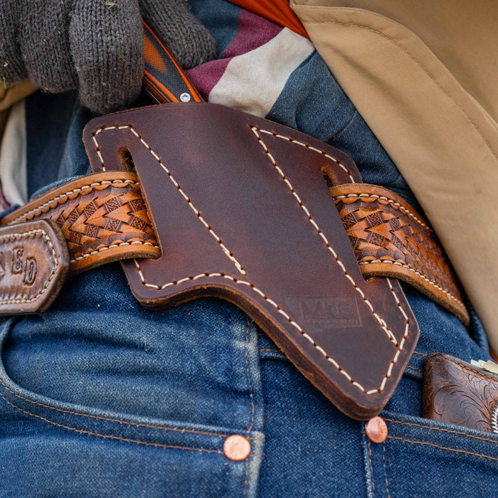 Angled leather sheath for belt carry, designed for secure knife storage and easy access. Durable and stylish for outdoor use.