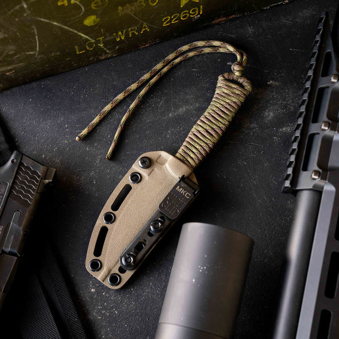 Tactical Speedgoat knife in Coy/Multicam with a textured handle and sheath, designed for outdoor and tactical use.