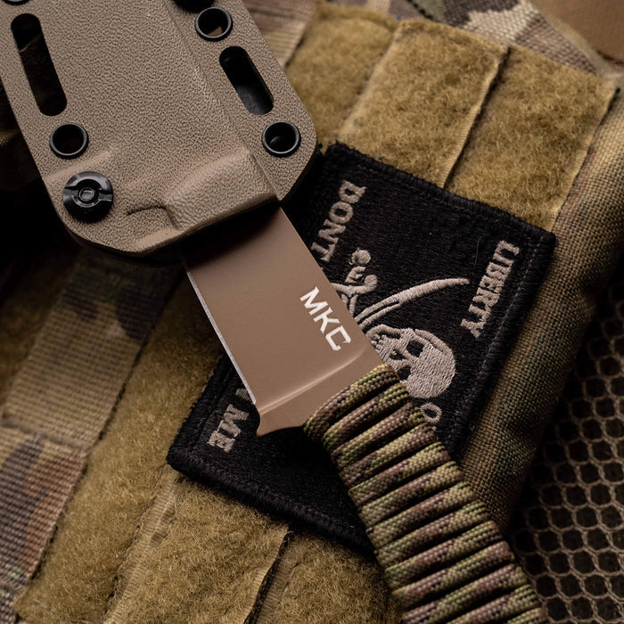 Tactical Speedgoat knife in Coy/Multicam sheath, showcasing durable materials and tactical design for outdoor use.