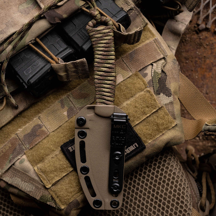 Tactical Speedgoat Kydex sheath in Flat Dark Earth, designed for secure knife storage and easy access in outdoor settings.