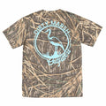 Dirty Marsh Outfitters Shadow Grass camouflage short sleeve t-shirt with light blue heron logo graphic and circular Dirty Marsh Outfitters text printed on the back.