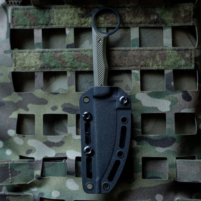 TEK-LOK belt attachment mounted on a camouflage background, designed for secure knife carrying and accessibility.