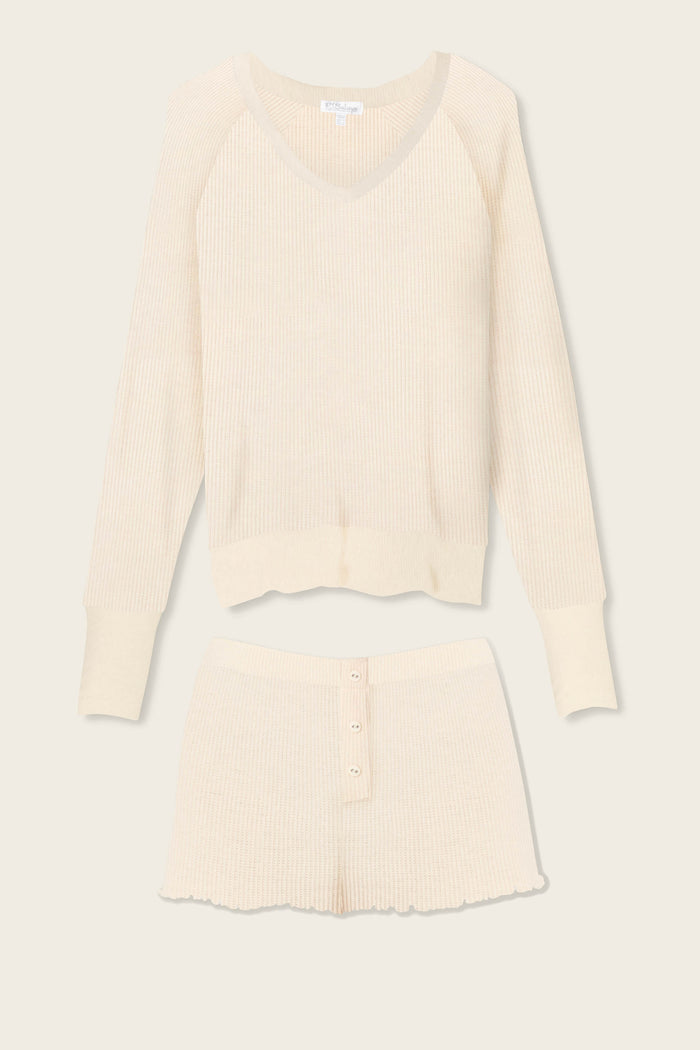 The P.J. Salvage Textured Essentials Stone Short Lounge Set features a cream ribbed knit V-neck long-sleeve top and button-front shorts, displayed flat on a light background.