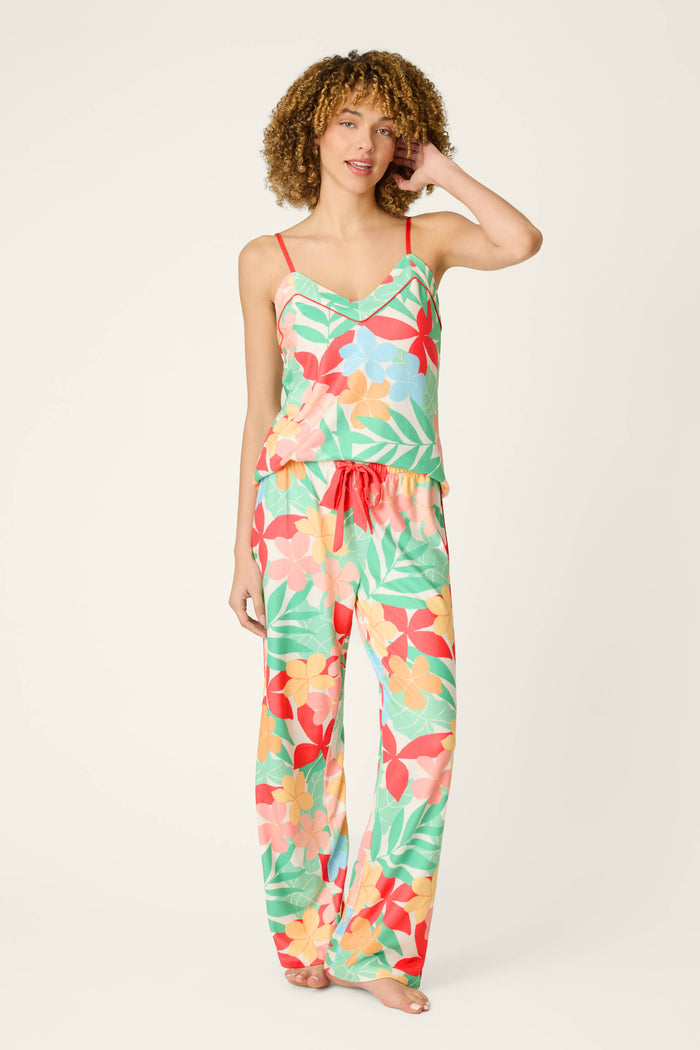 Tropical floral print fabric with vibrant colors and a soft, smooth texture against a plain light background.