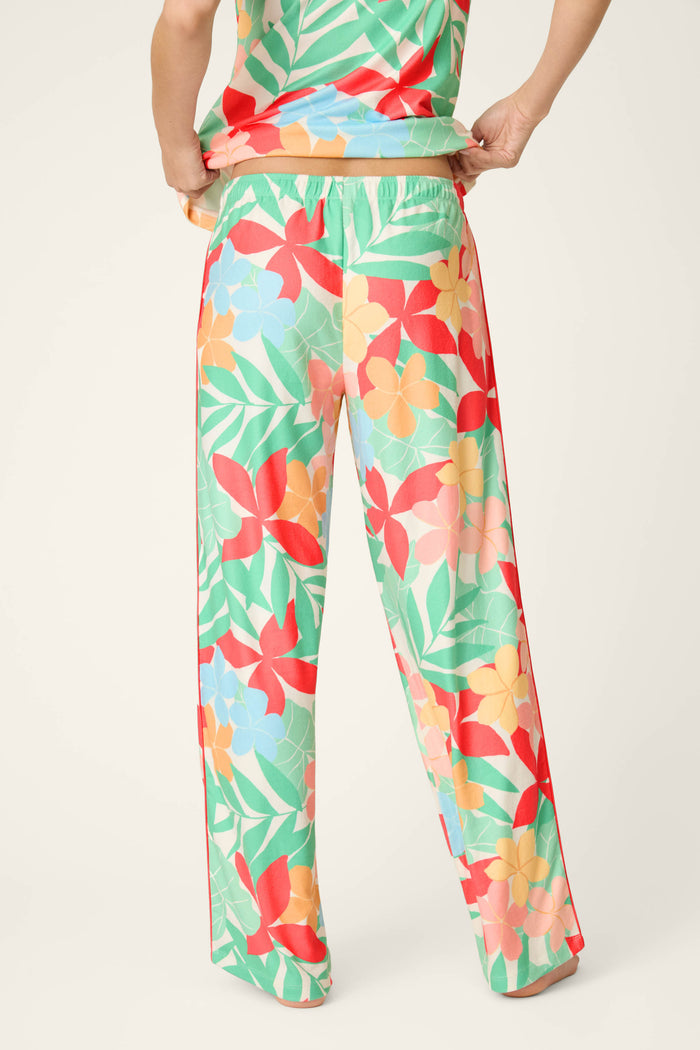 Vibrant tropical floral print with rich colors on buttery-soft jersey fabric, featuring a smooth, cozy texture.