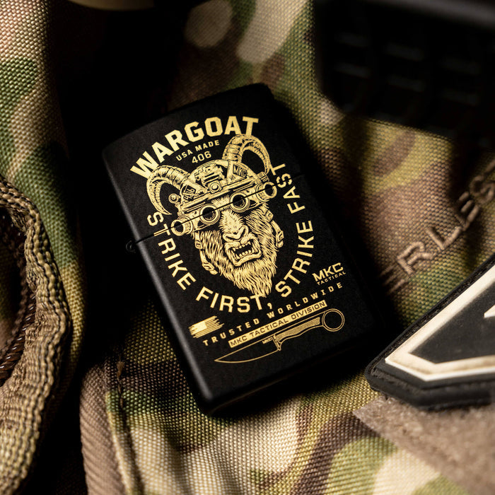 WARGOAT ZIPPO lighter featuring a bold gold design of a goat's head, set against a camo background.