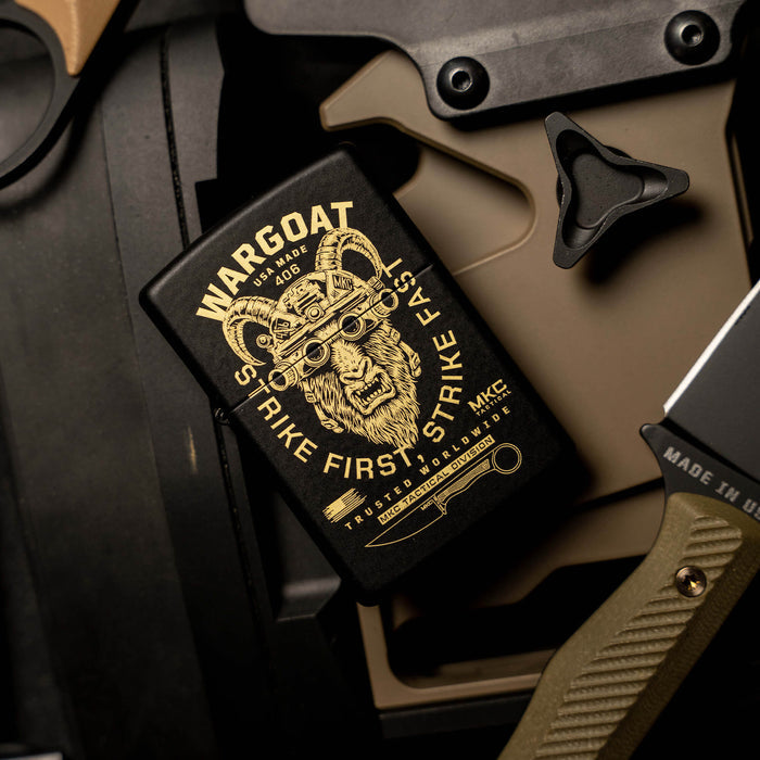 WARGOAT ZIPPO lighter featuring a striking goat design, set against tactical gear and a knife backdrop.