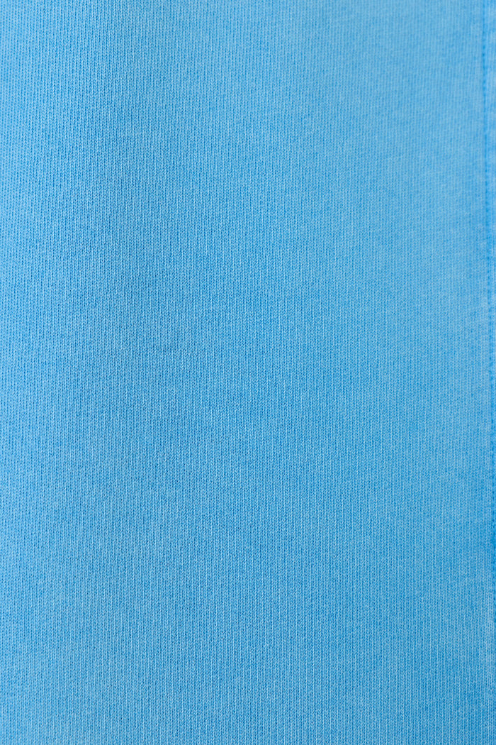 Close-up of the P.J. Salvage Washed Away Marine Blue Shirt Jacket fabric shows a smooth, evenly colored surface with subtle ribbed texture and fine vertical lines, making it ideal for a relaxed, stylish look.