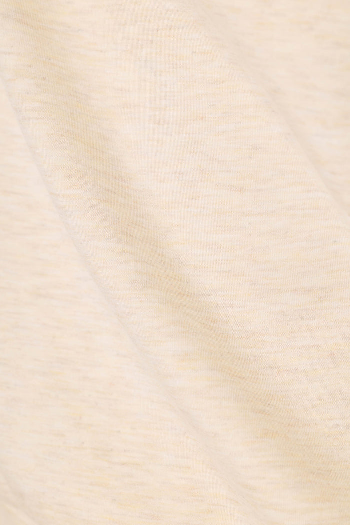 A close-up of a soft, heathered cream or off-white fabric texture with subtle warm beige undertones and gentle folds.