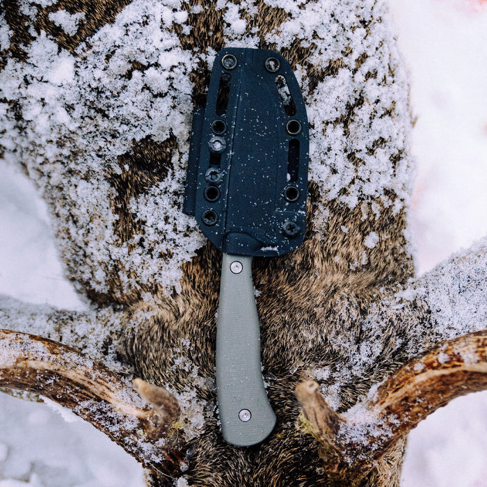 Kydex sheath for the Whitetail knife, designed for secure storage and easy access in outdoor conditions.